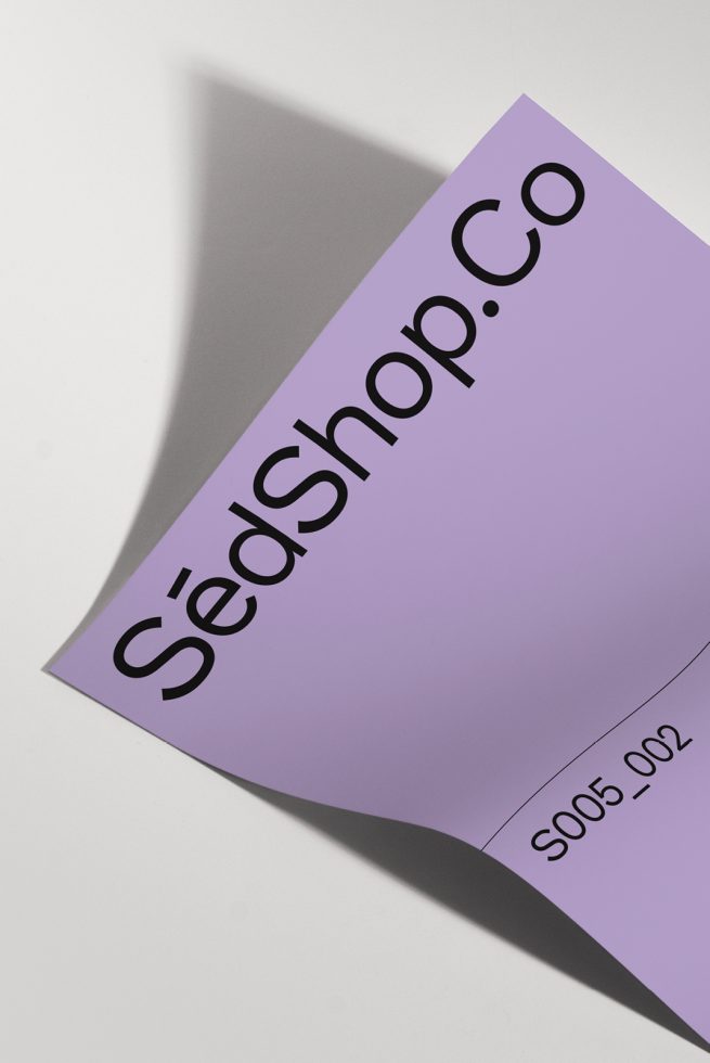 Curved paper mockup with a lavender gradient and shadow, displaying a logo and serial number for brand design presentations.